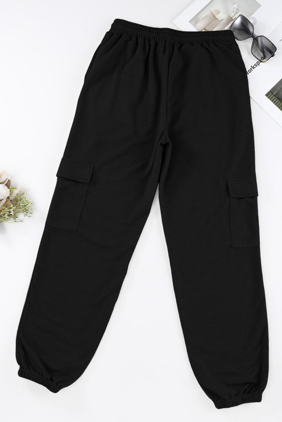 Pantalon de jogging noir à poche cargo et texture gaufrée