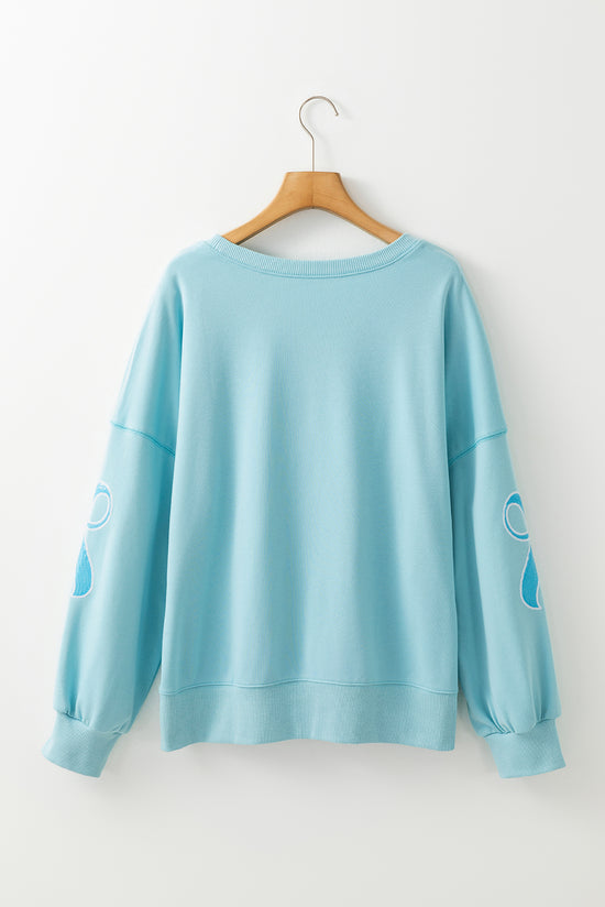 Over-dimensional sequined sweatshirt and butterfly knot with drooping shoulder