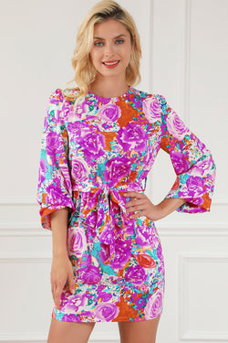 Purple floral dress with keyhole back and long sleeves with belt