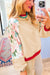 Beige patchwork print top with raglan sleeves and color block edge