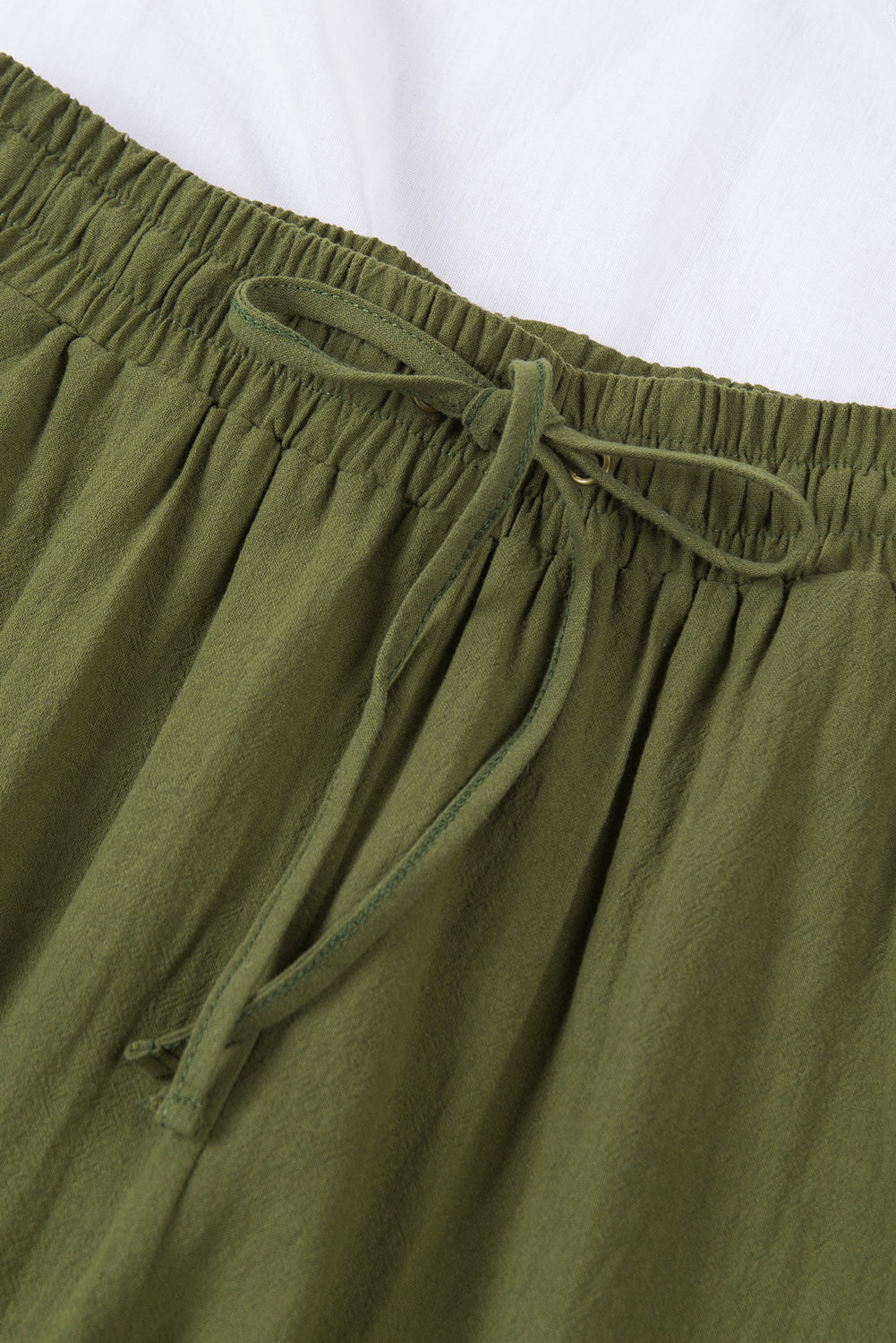 Pants with drawstring and elastic waist pockets, long straight legs green