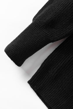 Black knitted sweater with puff sleeves and braided notched V-neckline