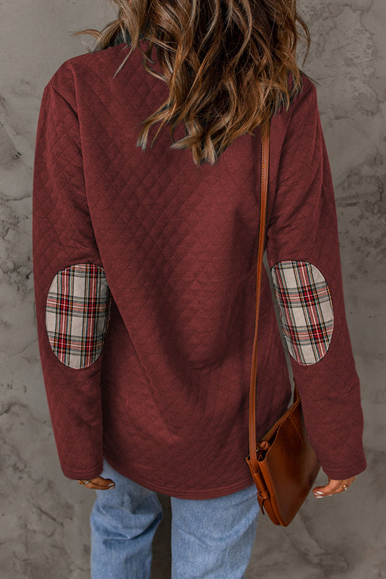 Bright red sweatshirt with geometric texture and plaid trim