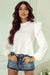 White blouse with puffy sleeves and ruffle border and ruffle collar