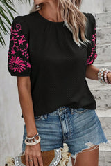 Black t-shirt with puffy textured sleeves embroidered with flowers