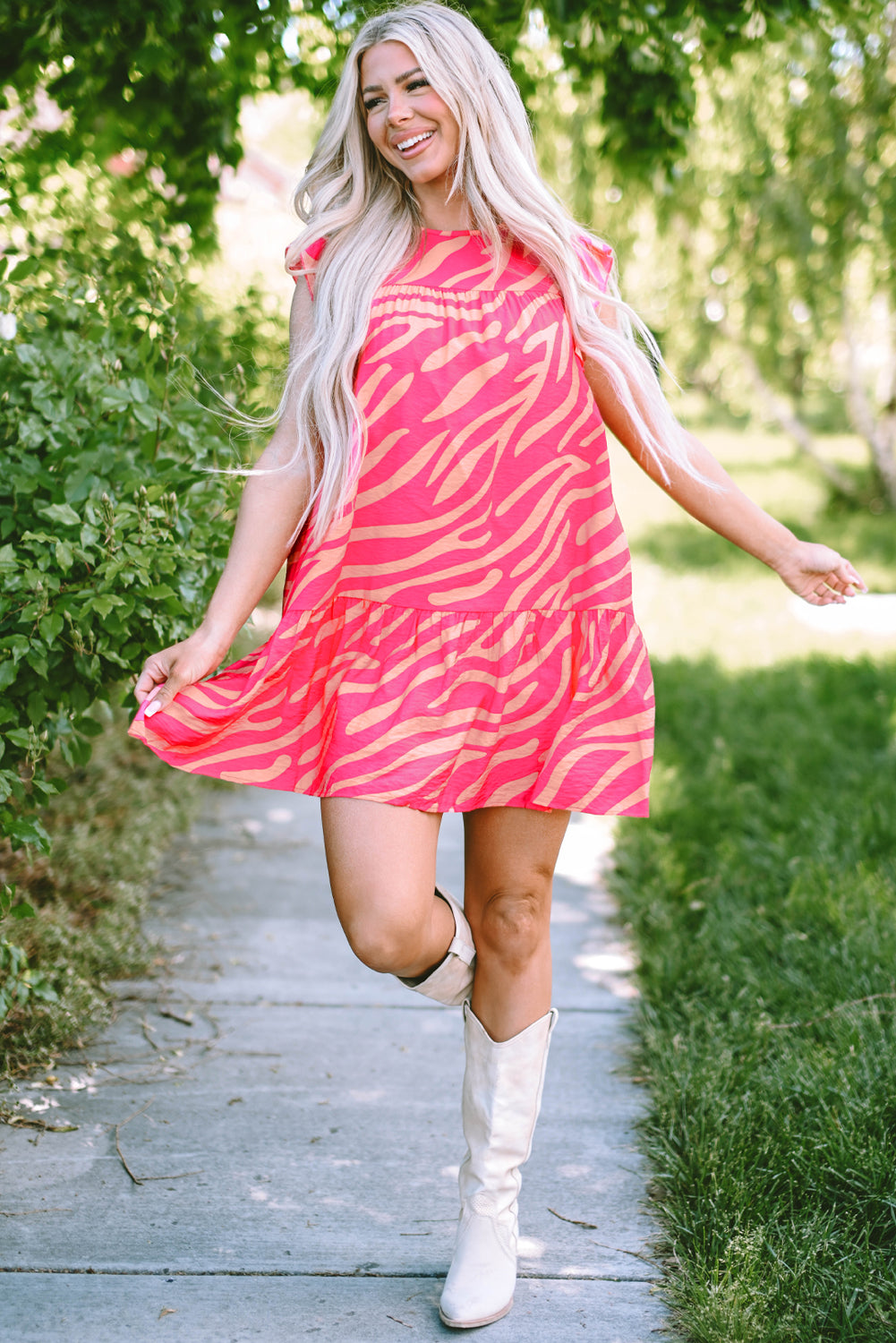 Pink dress with pockets and ruffle border printed with zero stripes