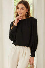 Chemisier ample plissé noir avec épaules rembourrées et poignets boutonnés-A WOMAN WE LOVE