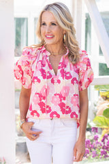 Pink flower high with split neck and puffy sleeves with ruffles