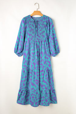 Sky blue long dress with abstract print, puffed sleeves, knotted and notched collar