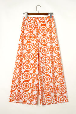 Pantalon large orange à imprimé floral style bohème rétro