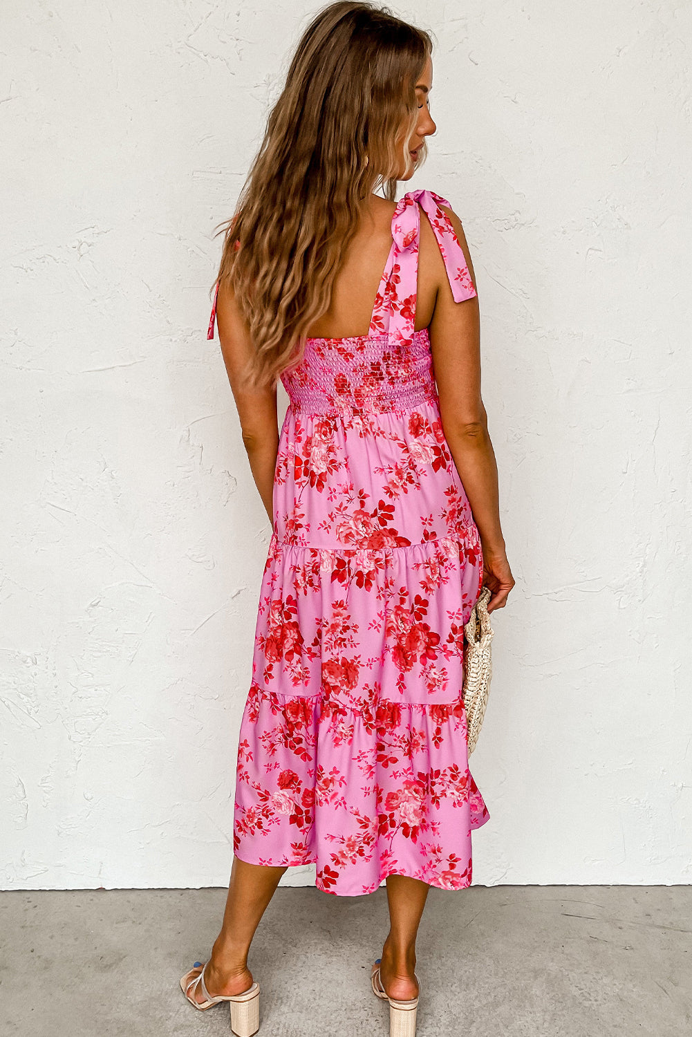 Pink floral dress with ruffles and tied straps