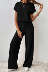 Combinaison noire côtelée à manches courtes et jambes larges de couleur unie-A WOMAN WE LOVE
