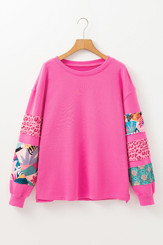 High pink sweater with mixed prints and drooping shoulder patches *