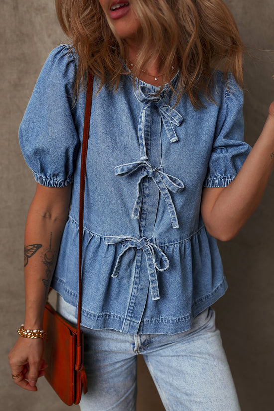 Twilight blue denim shirt tied on the front with bubble and basque sleeves