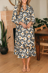 Robe longue noire à imprimé floral abstrait et col V