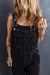 Black denim overalls with adjustable straps and multiple pockets