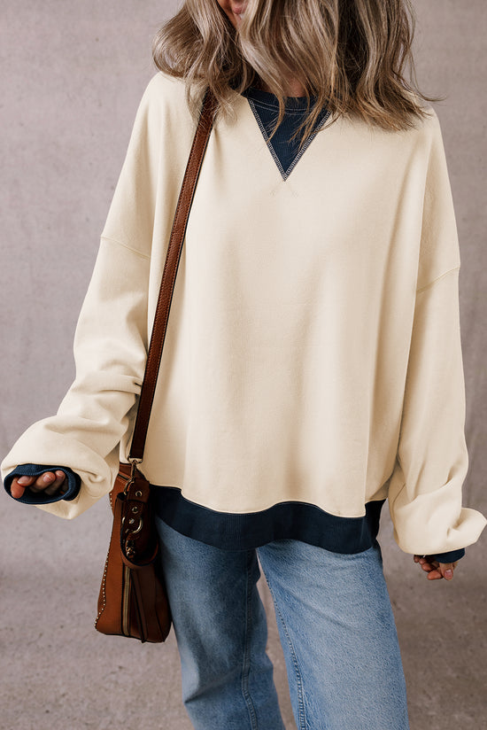 White oversized sweatshirt with dropped shoulders and color block patch