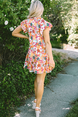 Purple floral print dress with split neck and flowing sleeves