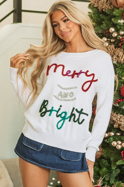 Bright and cheerful graphic Christmas sweater in white garlands