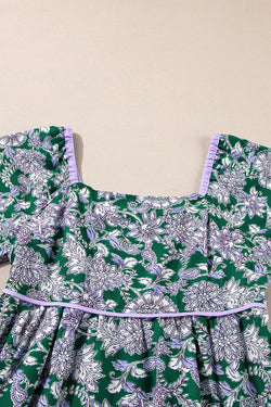 Green dress with floral print and border *