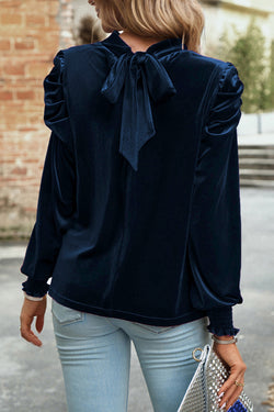 Navy blue velvet blouse with rising collar and puffy sleeves