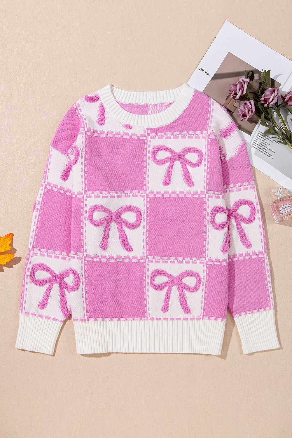 Pull col rond à carreaux bicolore rose avec nœud papillon