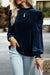 Navy blue velvet blouse with rising collar and puffy sleeves