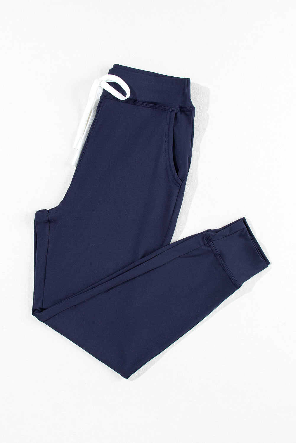 Navy blue jogging pants with pockets and drawstring waist