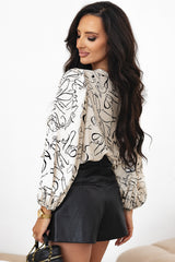 Blouse beige à col rond et A WOMAN WE LOVE