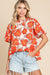 Orange loose sleeve blouse and flying collar and floral pattern