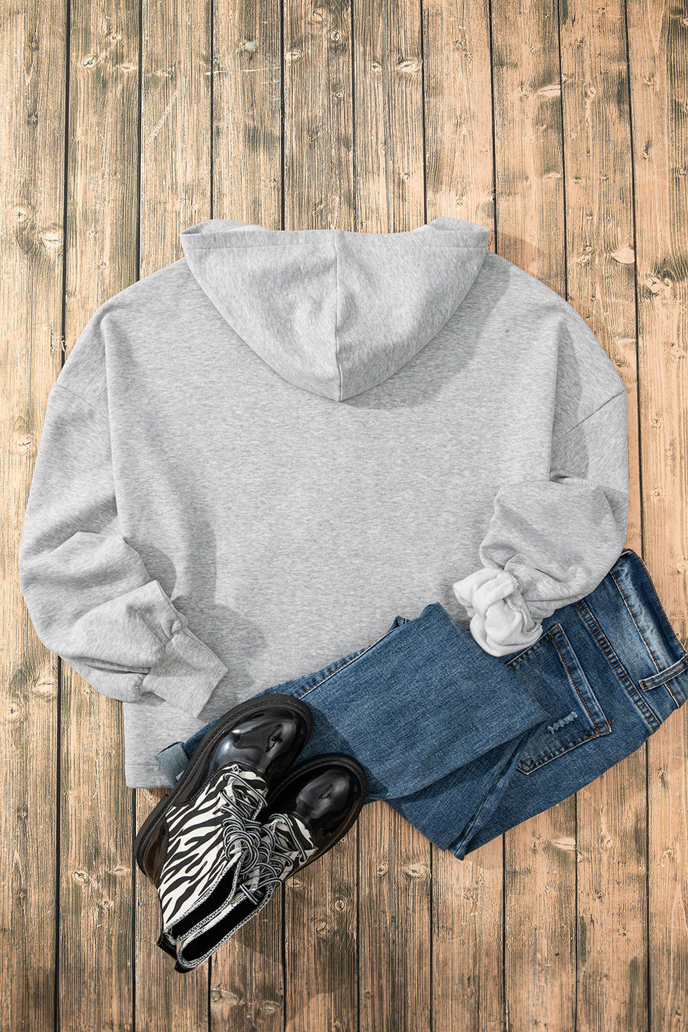 Light grey loose hoodie with half zip and fleece-lined kangaroo pockets