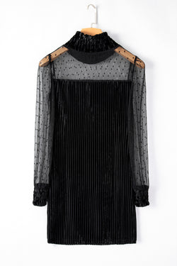 Black dress with bubble sleeves and ruffled collar striped in polka dot stitch