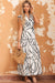 Long white dress with ruffles and V -collar with an abstract vein print