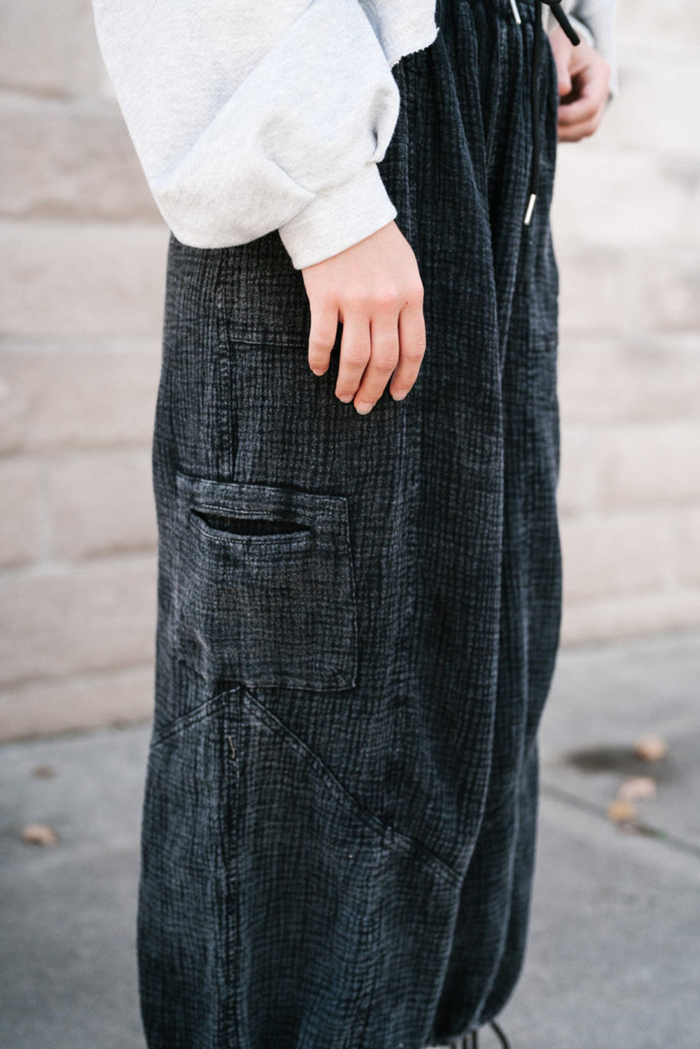 Black textured mineral wash wide leg pants with drawstring