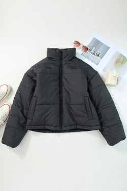 Black zipped down jackets with drawstring hem