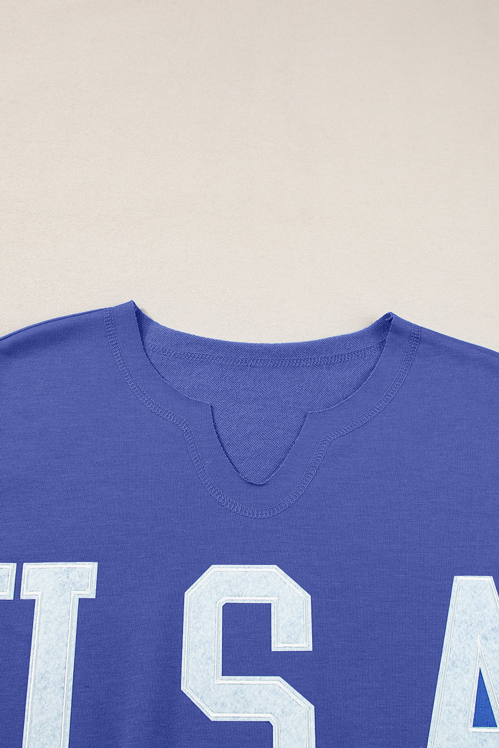 Dark blue loose t-shirt with lettering USA and notched collar
