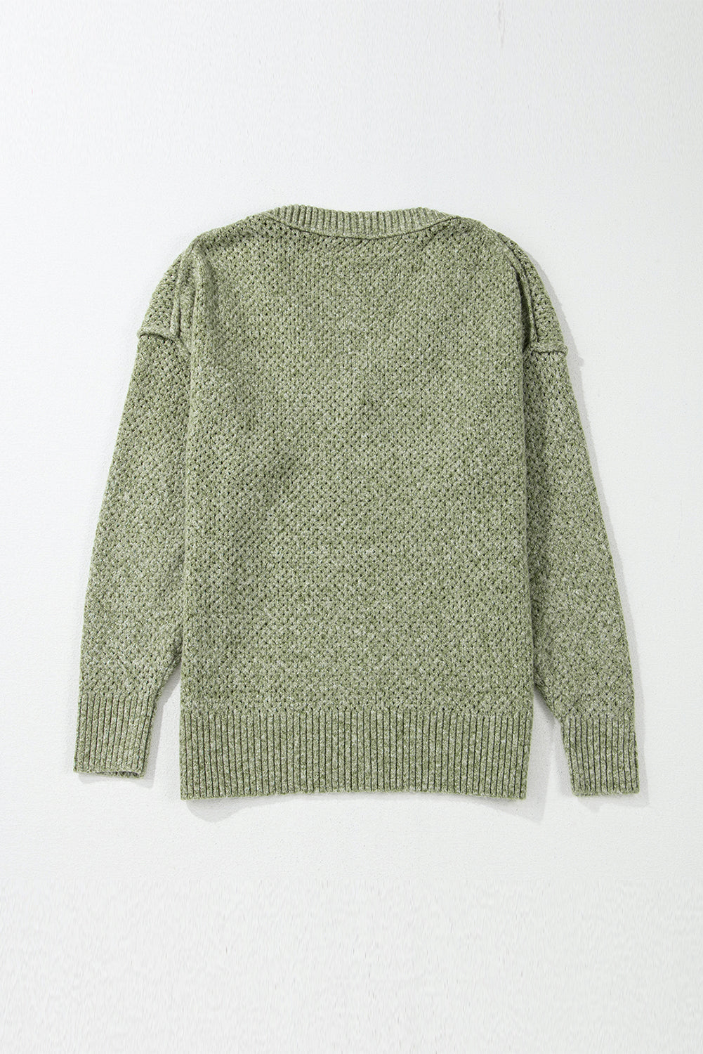 Pull ample à œillets vert jungle, col en V, épaules tombantes