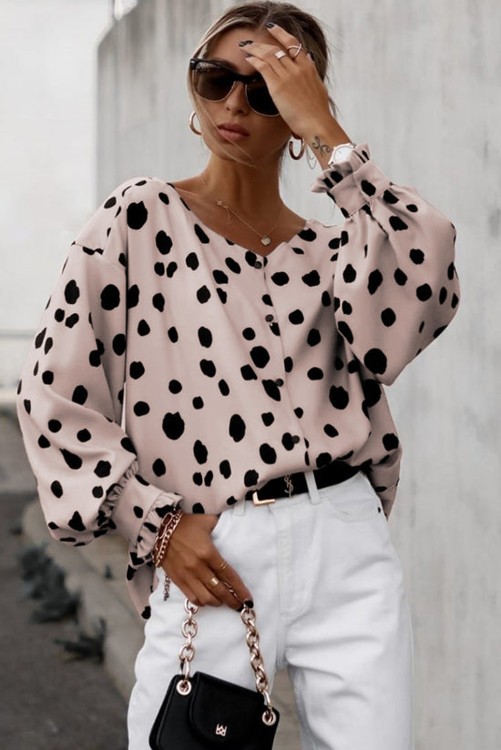 Surprised pink blouse with puffy sleeves and ruffle cuffs