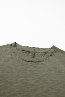 Solid green top with long sleeves and round neck