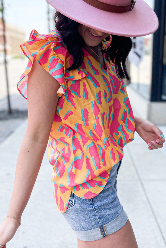 Orange blouse with abstract print *