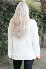 White textured sweatshirt at housing collar