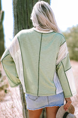 Grass green high low loose top with crochet details and exposed seams
