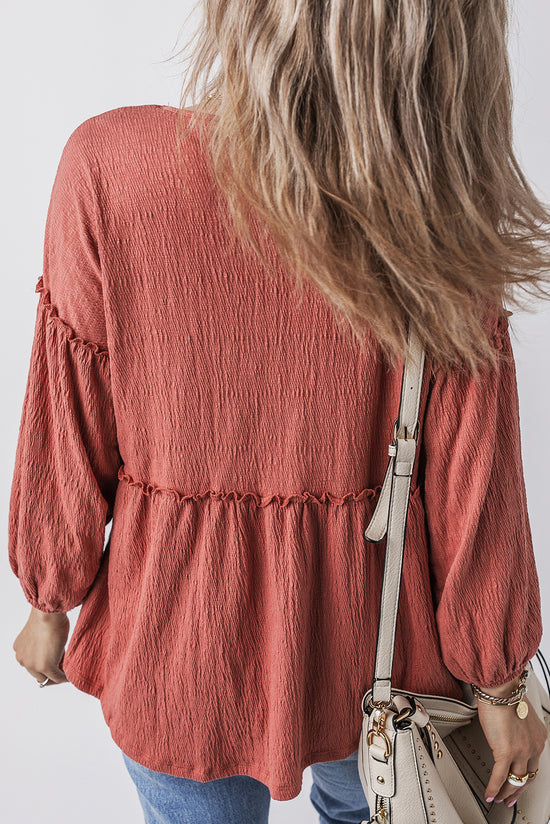 Puffy sleeve blouse and V -collar with tuffled ruffled in a solid mineral red colored