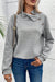 Grey textured sweatshirt with mock neck and asymmetrical buttons