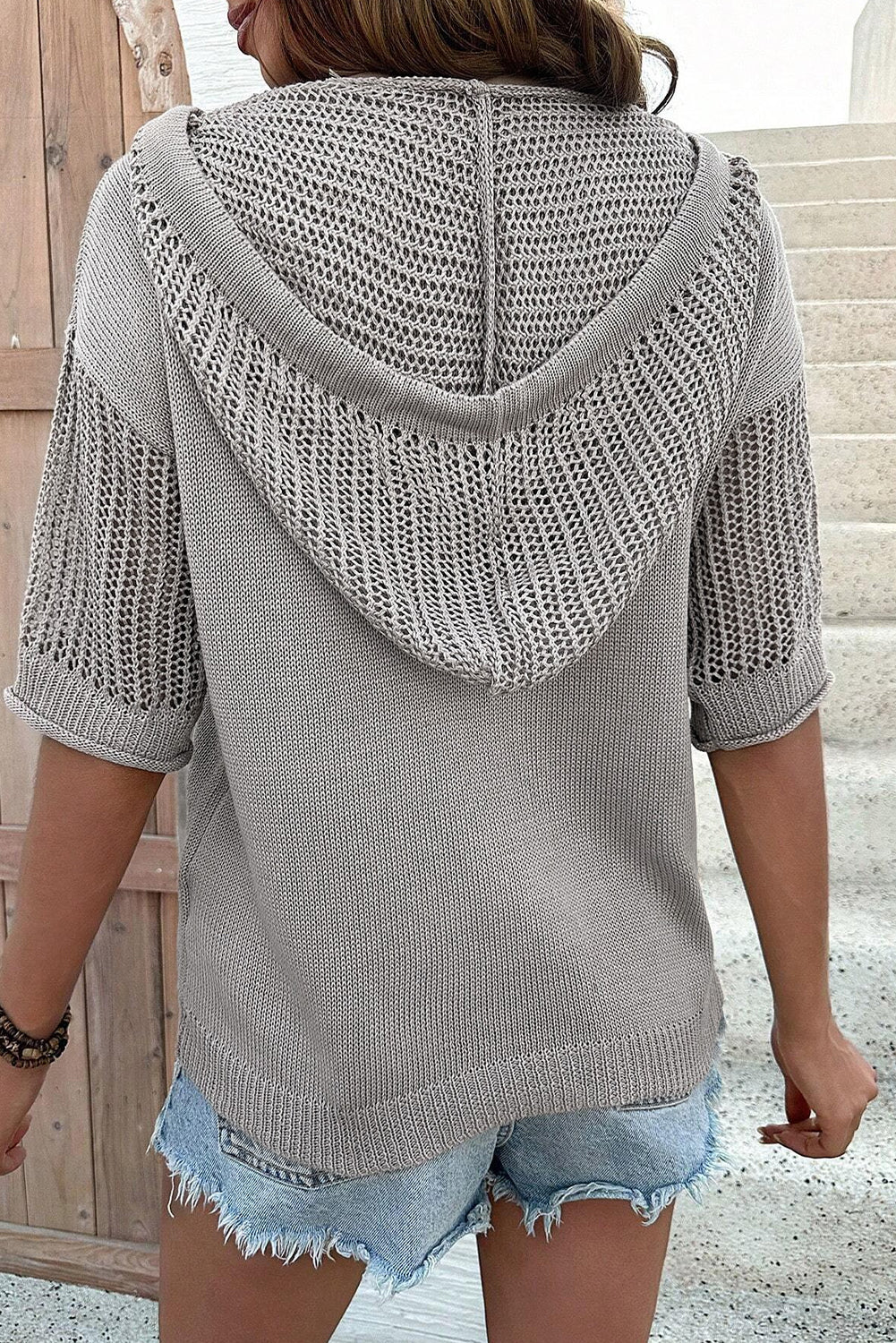 Light gray short sleeve pullover top with hood and openwork drawstring