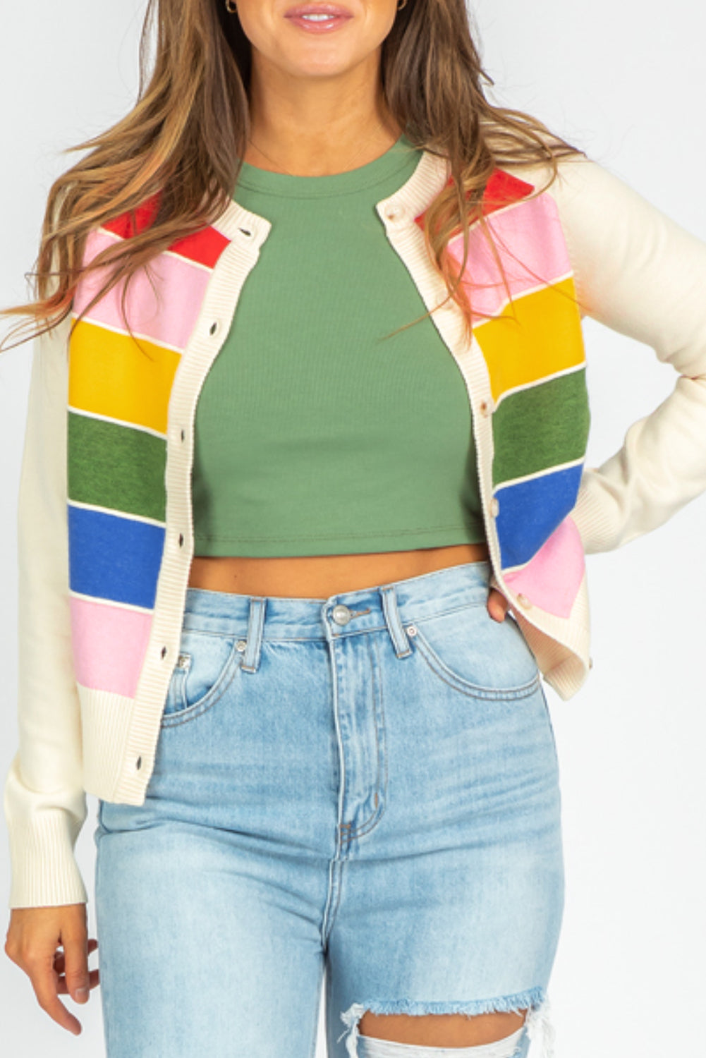 Cardigan with white striped and colored patterns, buttoned on the front