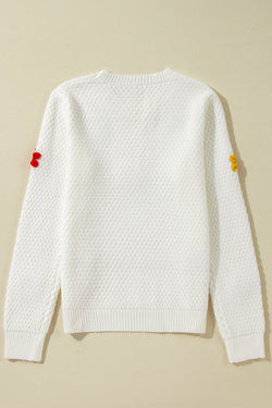 Pull en tricot texturé avec appliques de fleurs colorées blanches