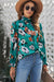 Smoked blouse with an upright collar and floral print