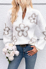 White high neck sweater with half zip and contrasting flowers