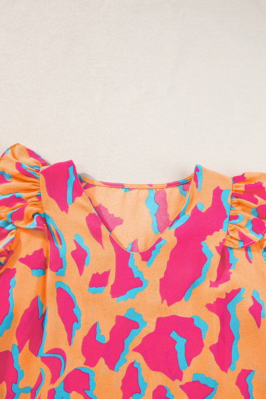 Orange blouse with abstract print *